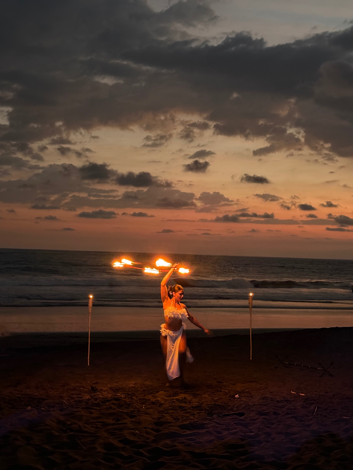 Fire dancer at sunset on Playa Hermosa beach