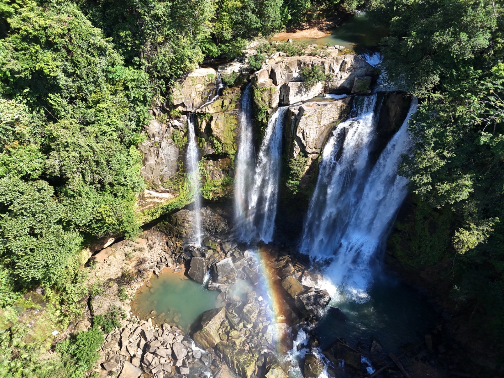 Aerial view of Nauyaca Waterfalls with rainbow in Costa Rica